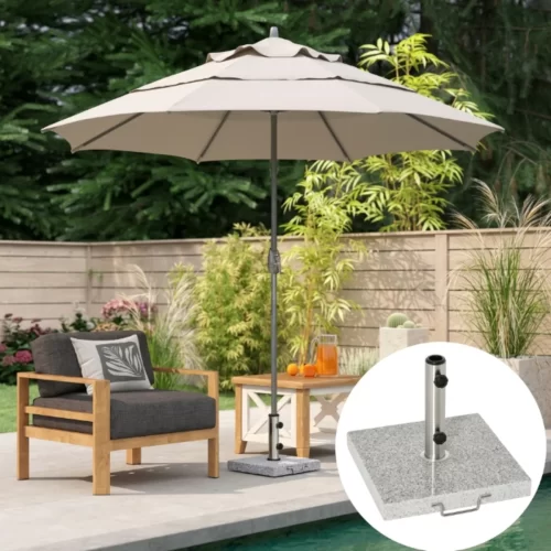 Base cuadrada gris textura granito con asa metálica junto a parasol en jardín
