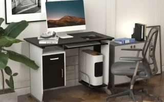 Escritorio de ordenador negro con silla ergonómica en oficina en casa 1400