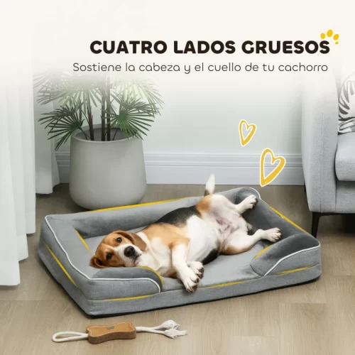Perro Beagle recostado boca arriba en una cama con bordes gruesos que sostienen cabeza y cuello.