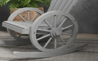 Mecedora de exterior gris tipo rueda de carro sobre una alfombra de raya